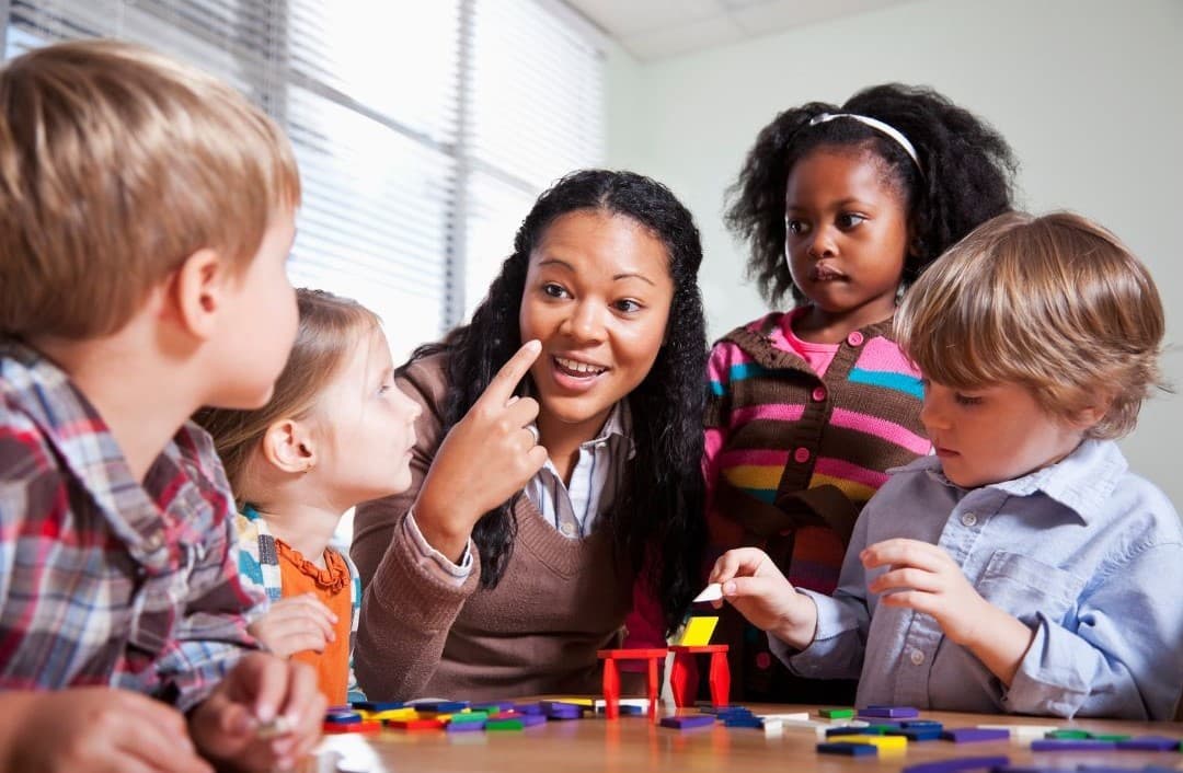 A therapist working with children at Active Care Center